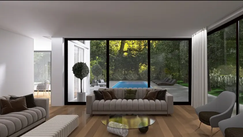 Modern living room with a beige sofa, glass coffee table, and floor-to-ceiling windows overlooking a pool and garden.