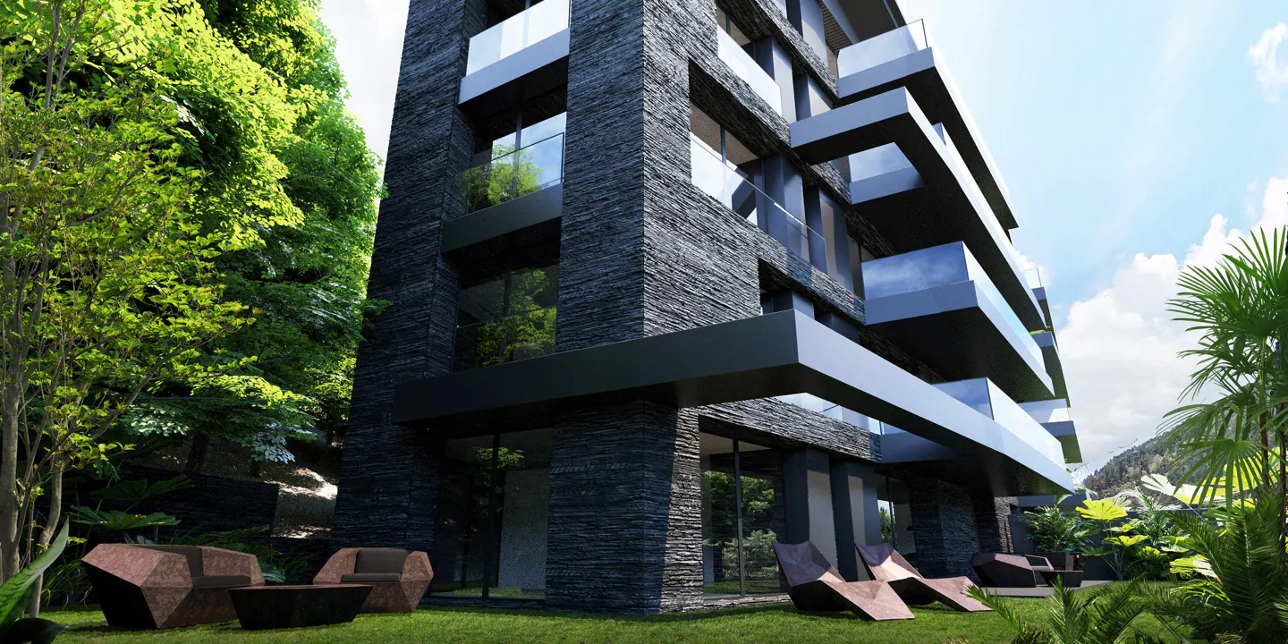 Modern stone apartment building with glass balconies, surrounded by lush green trees and lawn with outdoor seating.