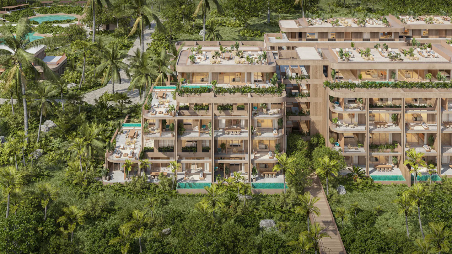 Aerial view of a modern, multi-story resort building with private balconies and pools, surrounded by lush tropical greenery.