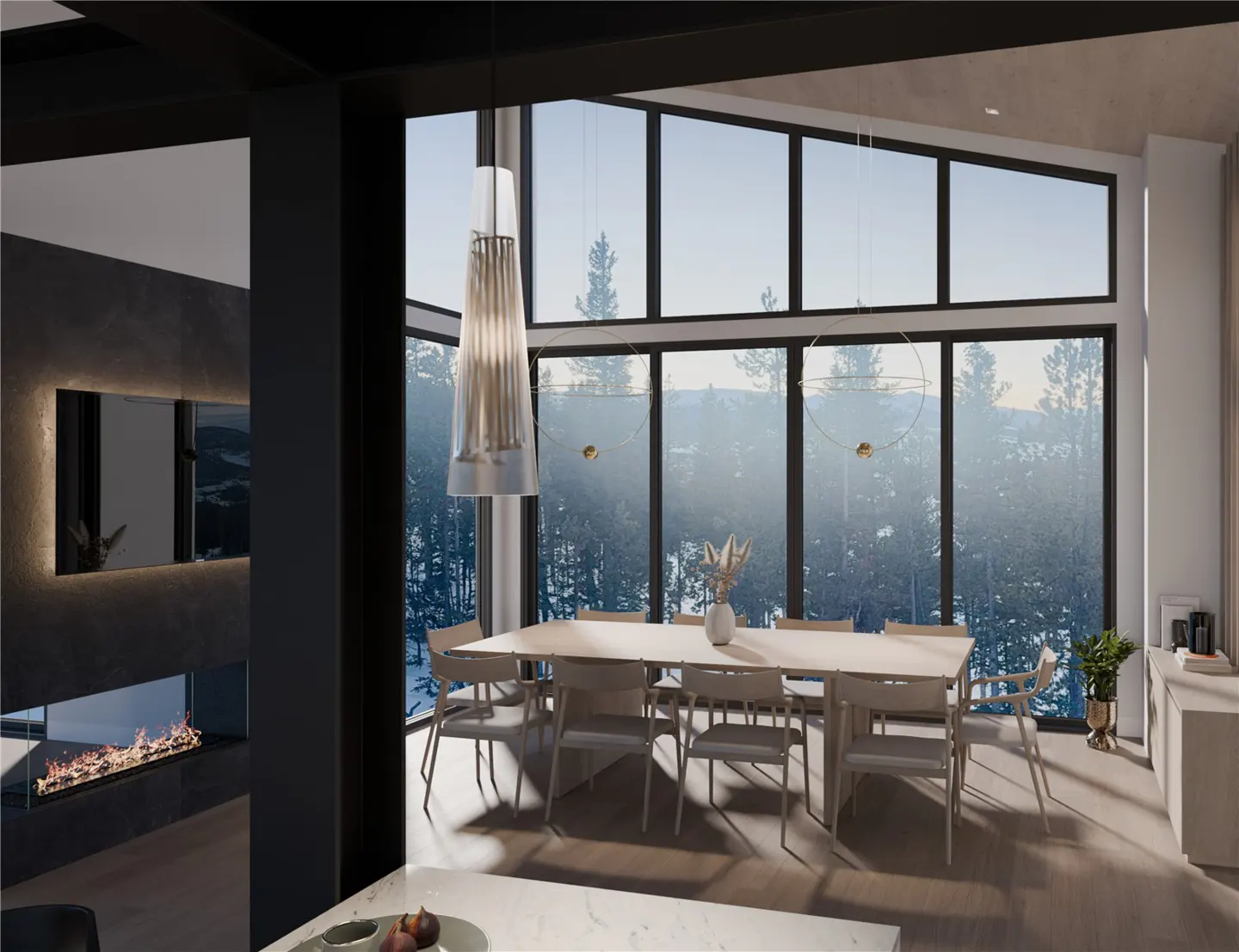 Modern dining room with a long table, chairs, and large windows overlooking a snowy forest. A fireplace is visible in the background.