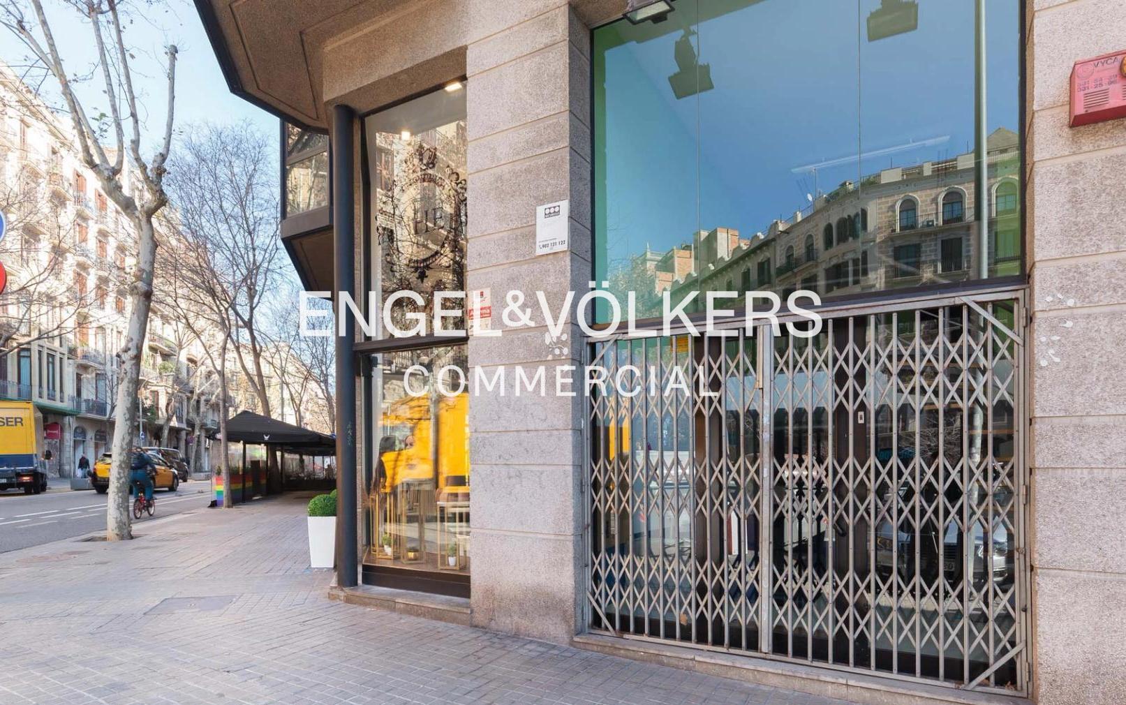 Exterior view of Engel & Völkers Commercial office with metal security gate and street view.