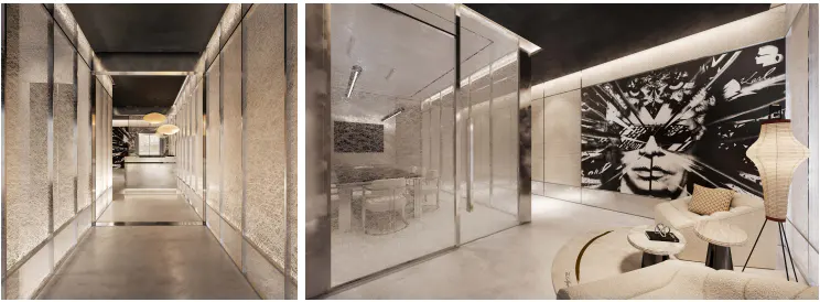 Modern hallway with textured walls and glass partitions leading to a lounge area with a large black-and-white portrait mural.