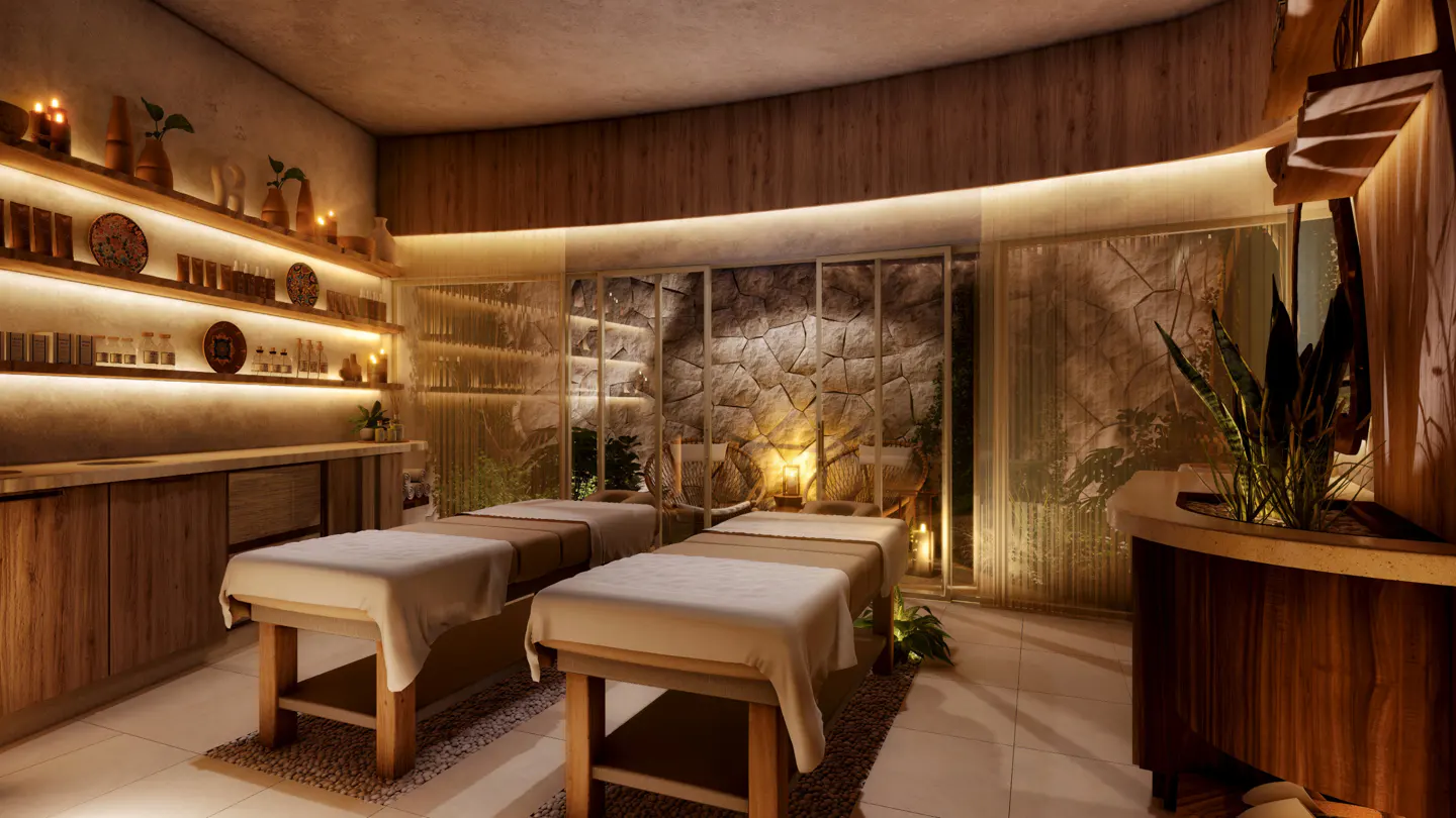Spa room with two massage tables, wooden cabinets, shelves with products, stone wall, and plants.