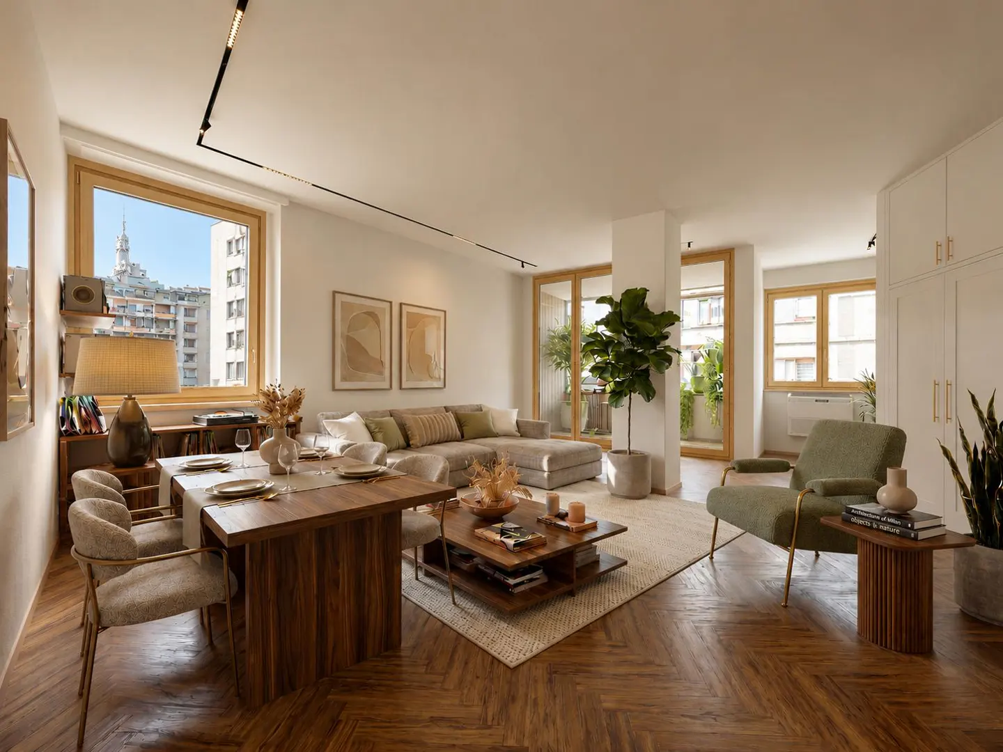Modern living room with herringbone wood floors, a wooden dining table, beige sectional sofa, and a green armchair.