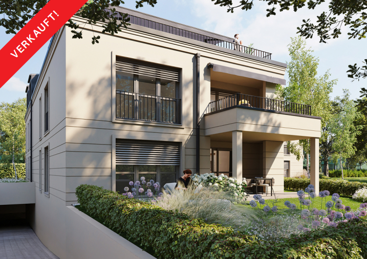 Modern beige apartment building with a balcony, rooftop terrace, and garden, marked with a red "SOLD" banner.