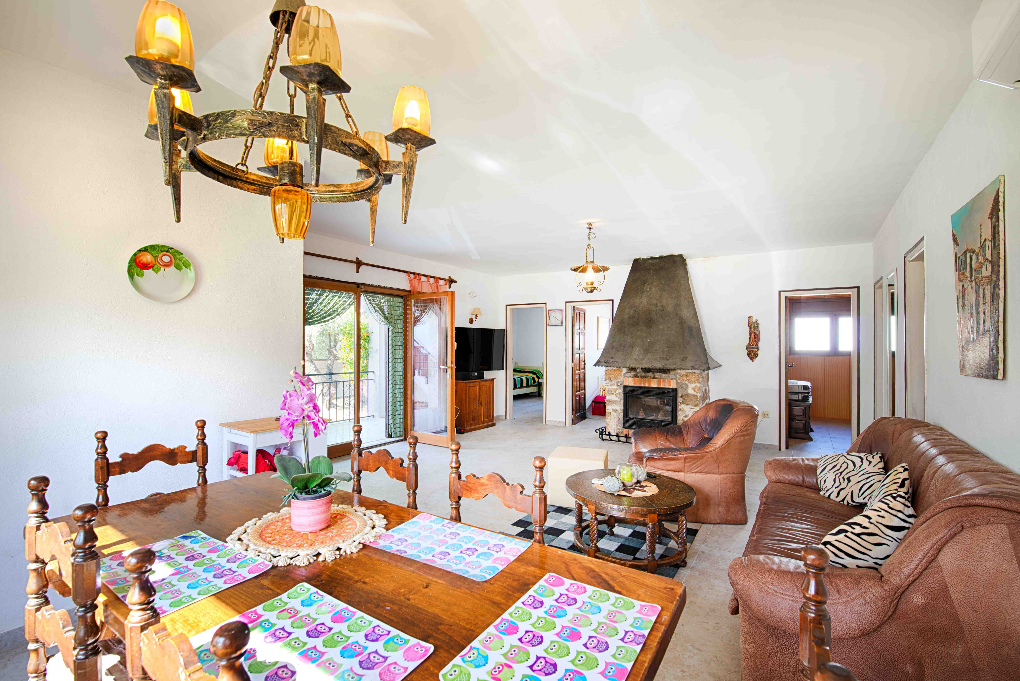 Charming Single-Level Home with Garden, Garage & Rooftop Views in Roses