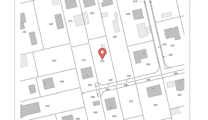 Real estate map showing property lines and parcel numbers, with a red pin marking parcel 576.
