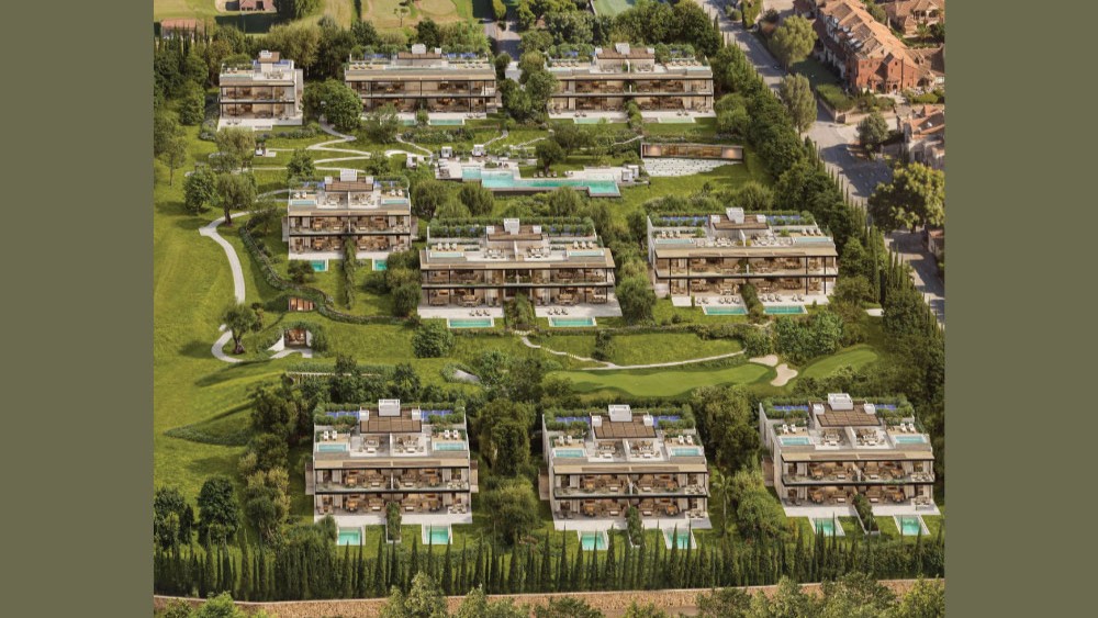 Aerial view of a luxury residential complex with modern multi-story buildings, private pools, and lush green landscaping.