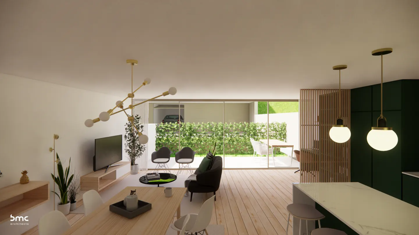 Open-concept living space with wood floors, a dining table, and a black sofa. Large windows overlook a green garden. Modern lighting fixtures.