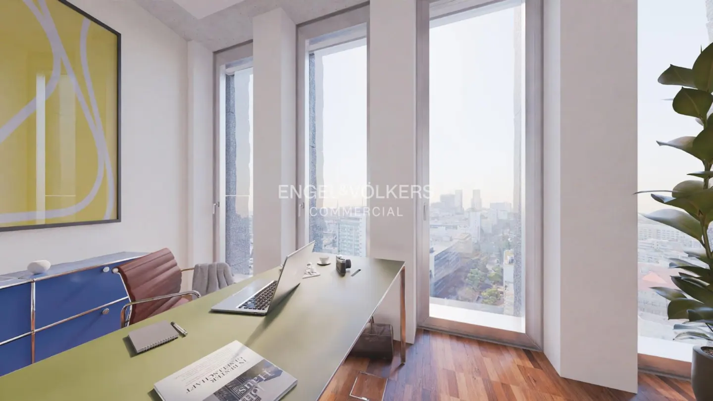 Modern office with a desk, laptop, and chair, featuring floor-to-ceiling windows with a city view and yellow wall art.