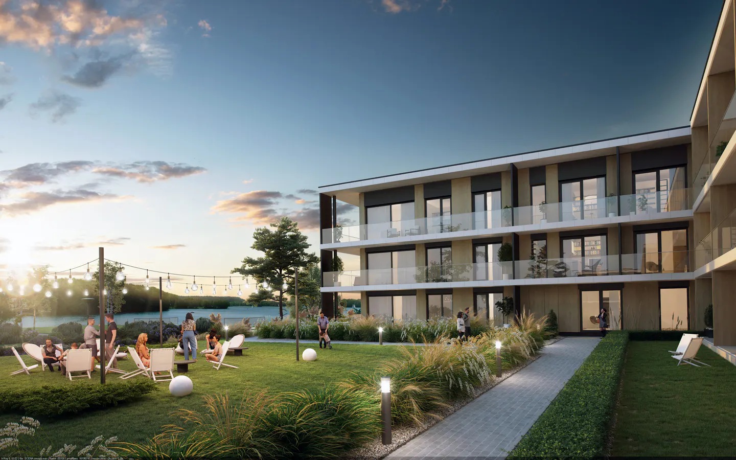 Modern apartment building with balconies overlooking a grassy courtyard at sunset, with people relaxing on patio furniture.