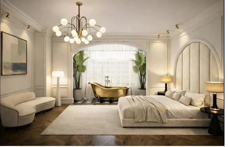 Opulent bedroom with a gold bathtub, white walls, and a large bed. A modern chandelier hangs above. Plants flank the tub.