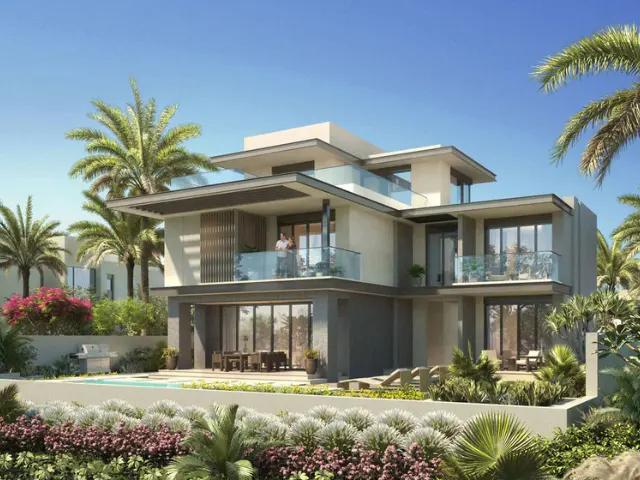 Modern two-story house with balconies, pool, and palm trees under a blue sky. A couple stands on the upper balcony.