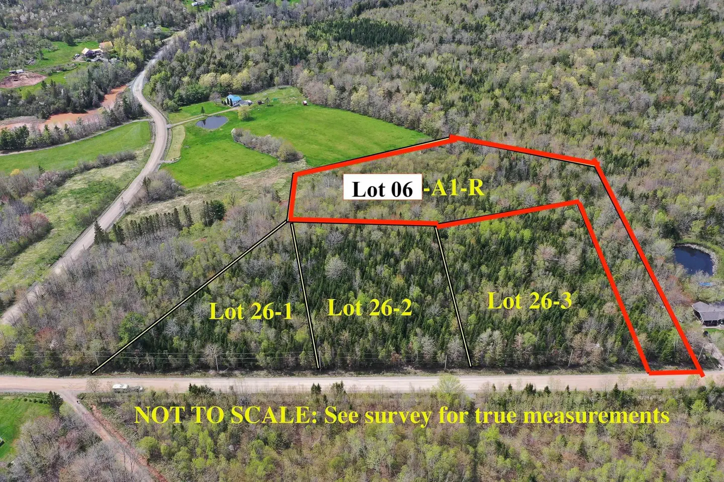 Aerial view of wooded land lots, outlined in red, with lot numbers labeled in yellow text. A road runs along the bottom edge. "NOT TO SCALE" text.