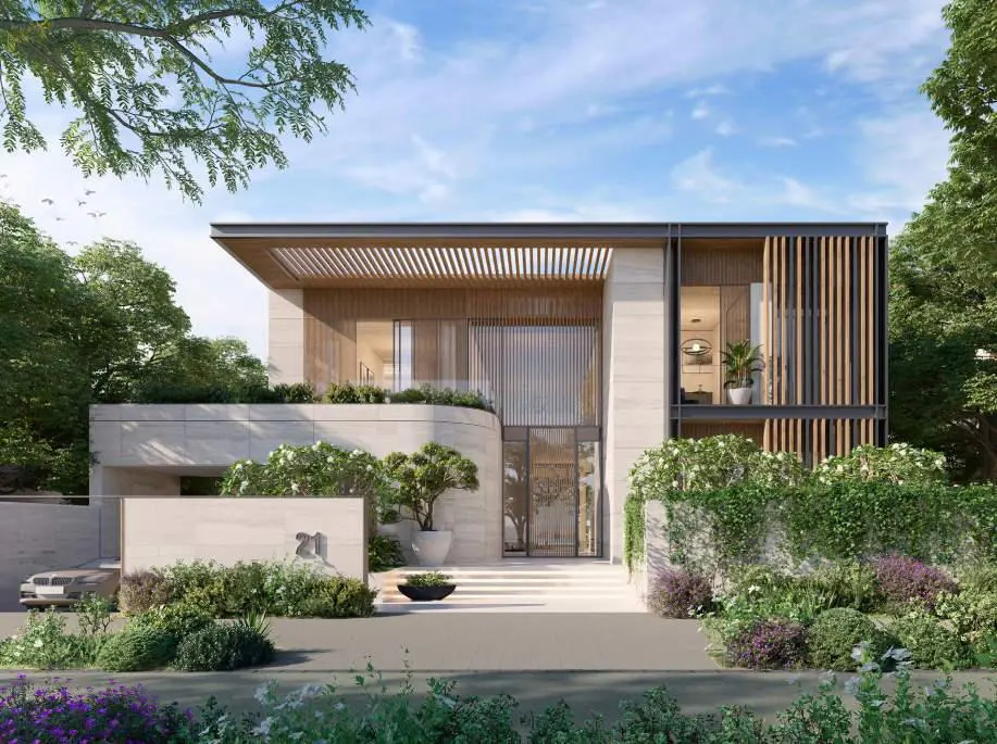 Modern two-story luxury home with stone facade, wooden slats, and lush landscaping under a bright blue sky.