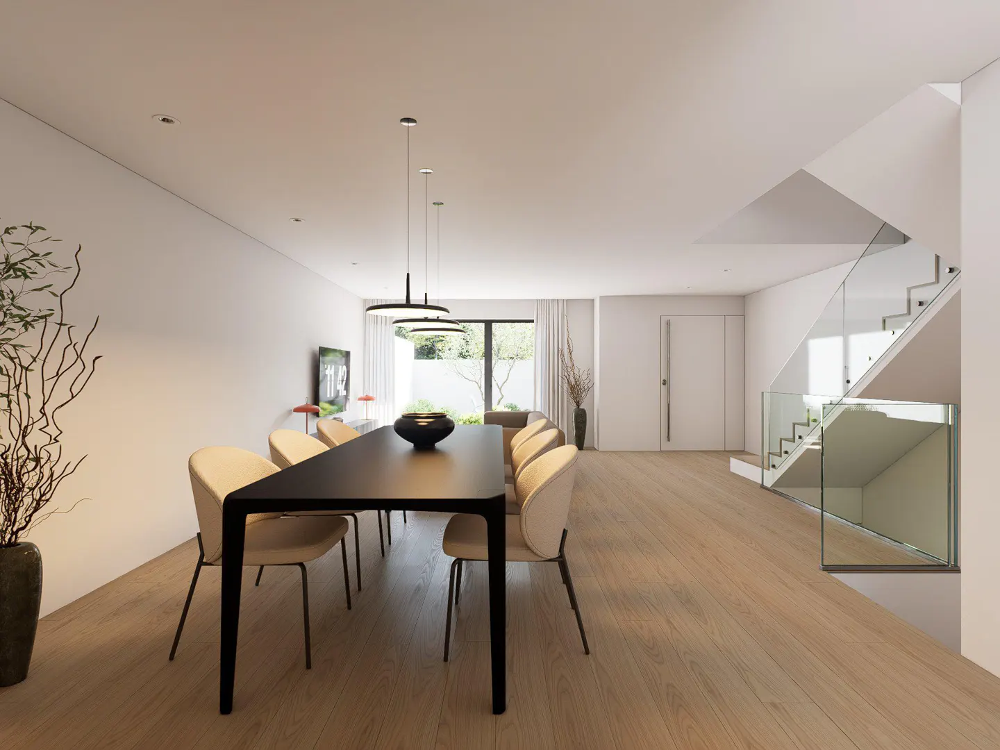 Bright, modern dining room with a black table, beige chairs, and wood floors. A glass-railed staircase is visible in the background.