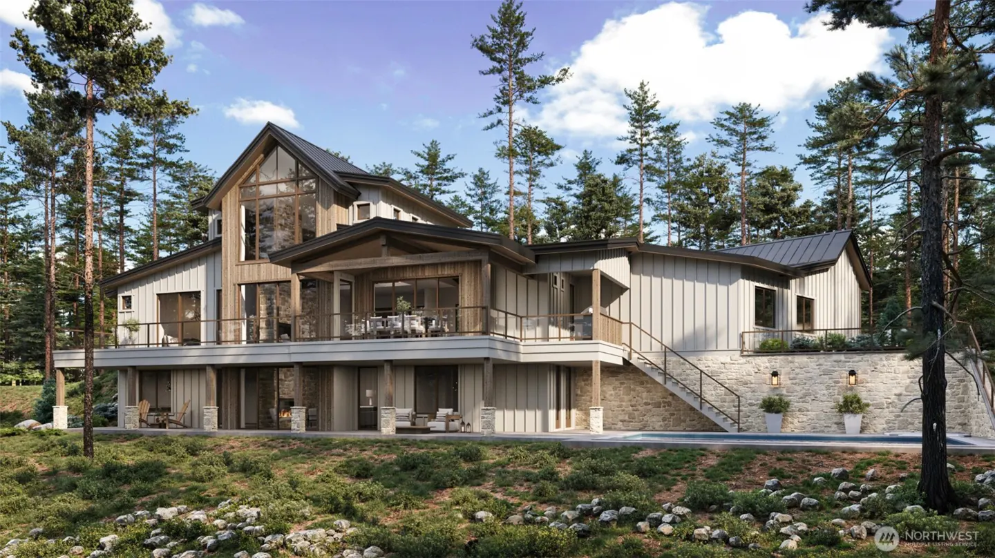 A modern, multi-level home with wood and light gray siding, surrounded by tall trees and lush greenery.