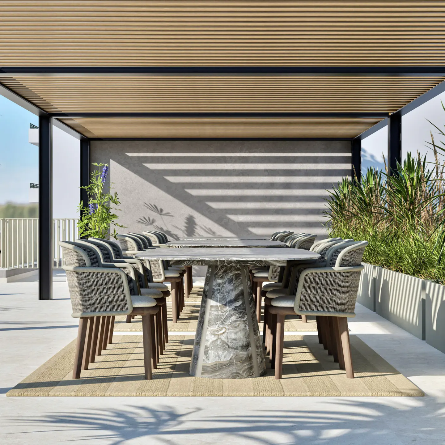 Outdoor dining area with a long marble table, woven chairs, and a pergola casting shadows on the wall.