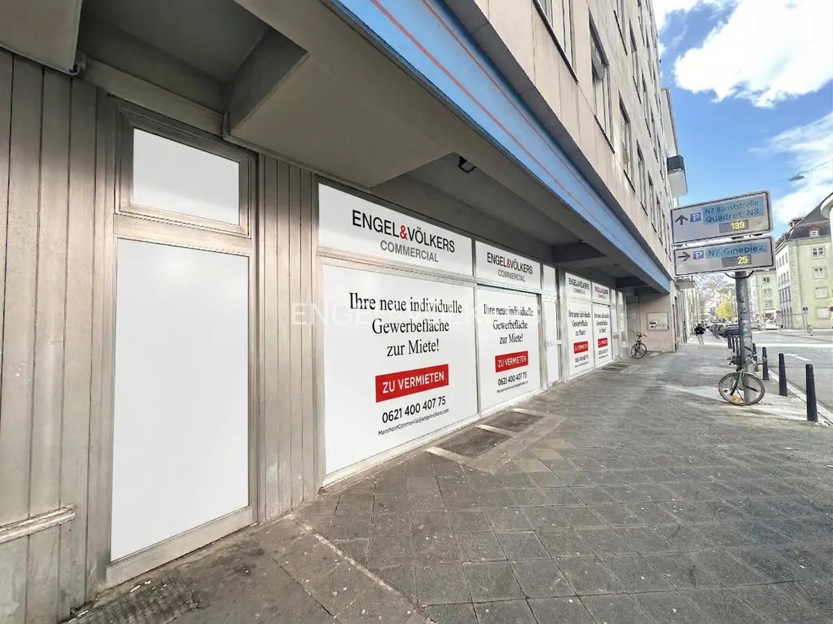 Engel & Völkers Commercial storefront with "For Rent" signs on a city sidewalk.