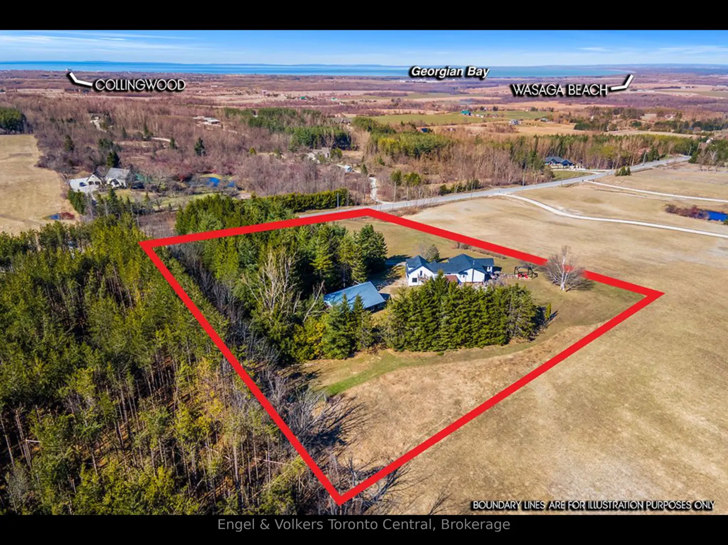 Aerial view of a property outlined in red, featuring a house, outbuilding, trees, and fields near Georgian Bay.