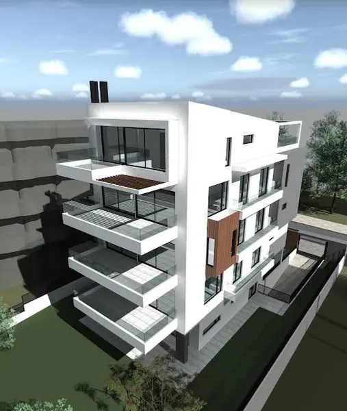 Modern white apartment building with glass balconies and a green lawn.