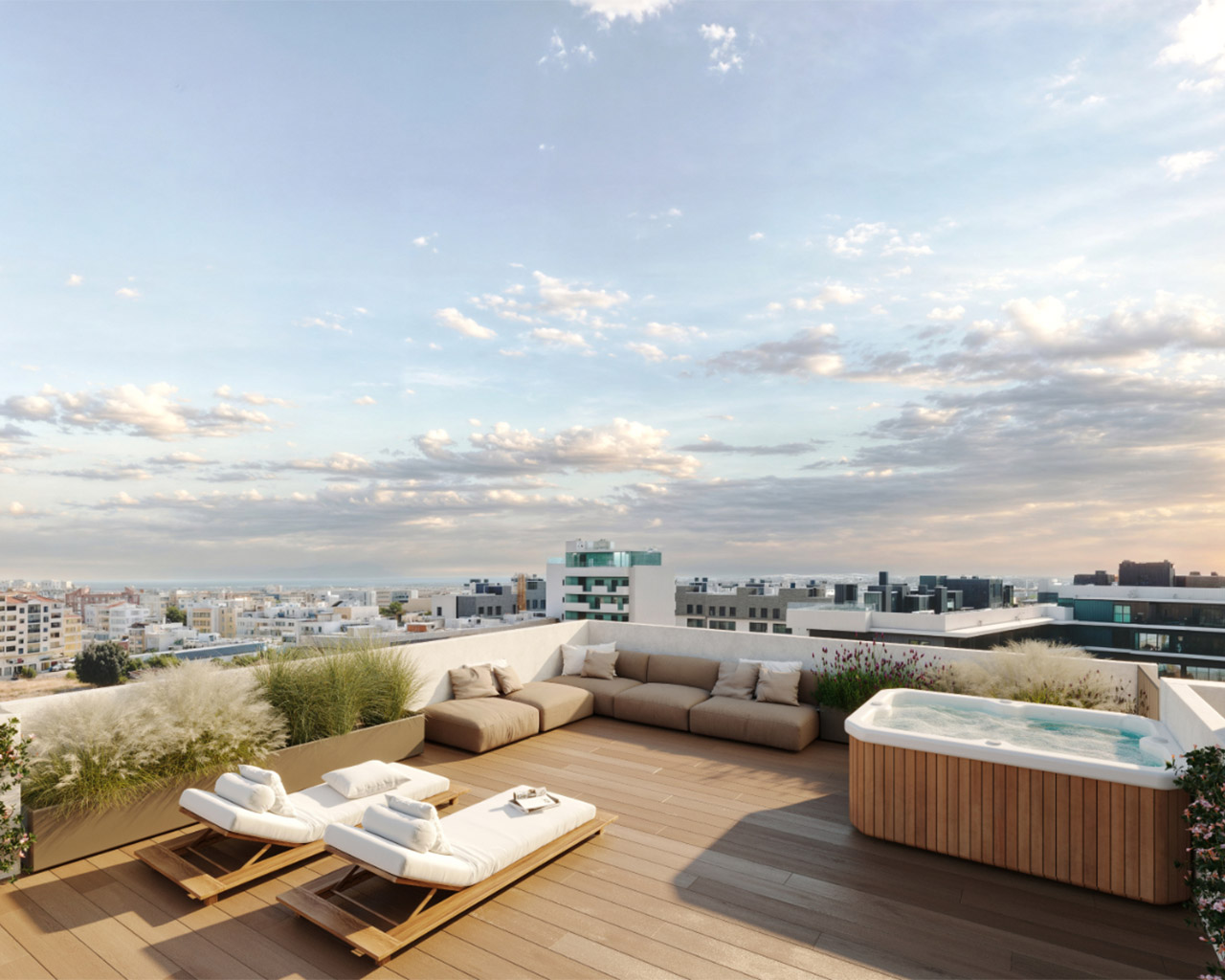 Rooftop patio with two white lounge chairs, a beige sectional sofa, and a wooden hot tub overlooking a city skyline under a cloudy sky.