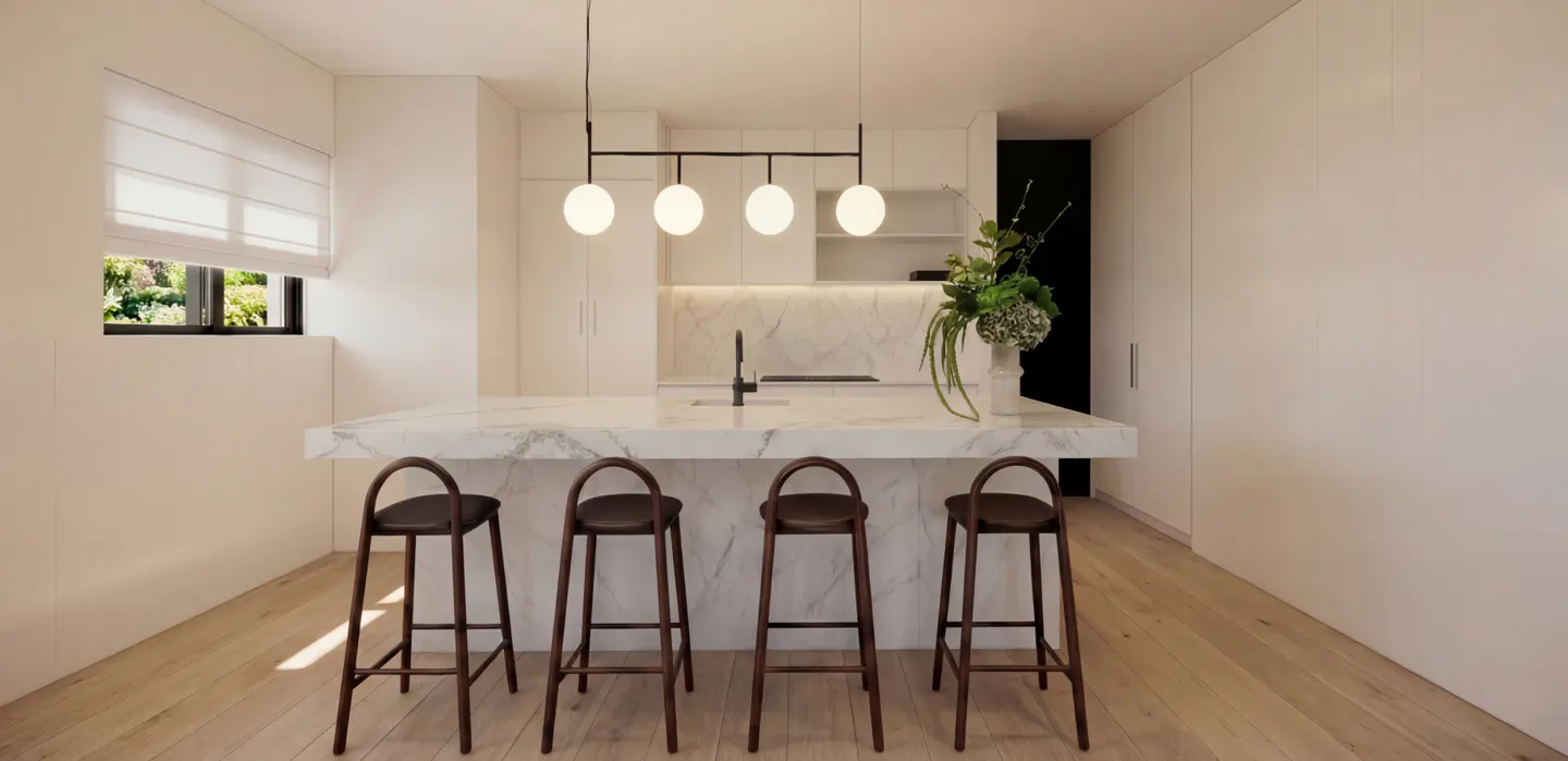 Bright, modern kitchen with white cabinets, marble island, and four brown stools. A black light fixture hangs above the island. A vase of flowers sits on the counter.