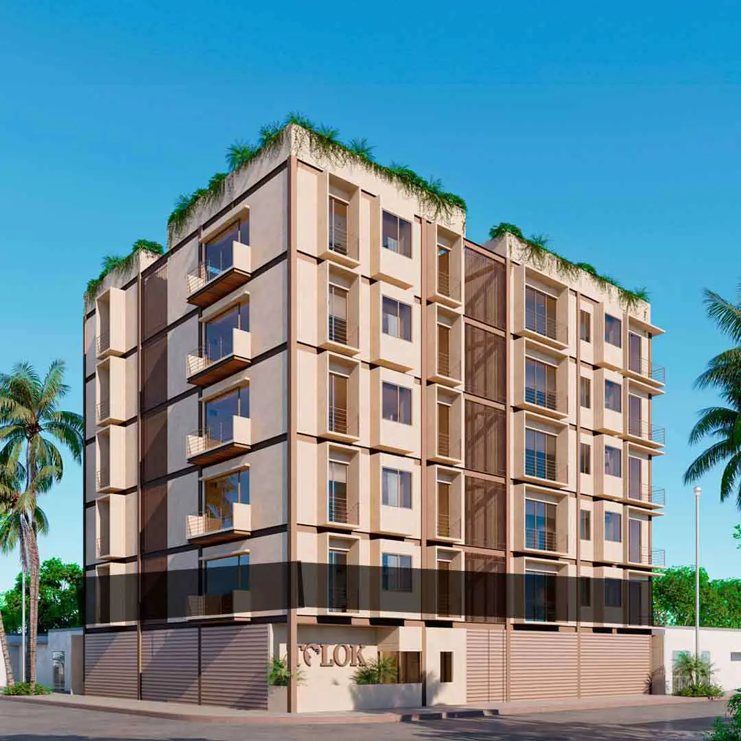 Exterior view of a modern, multi-story apartment building with balconies and rooftop greenery, under a clear blue sky.