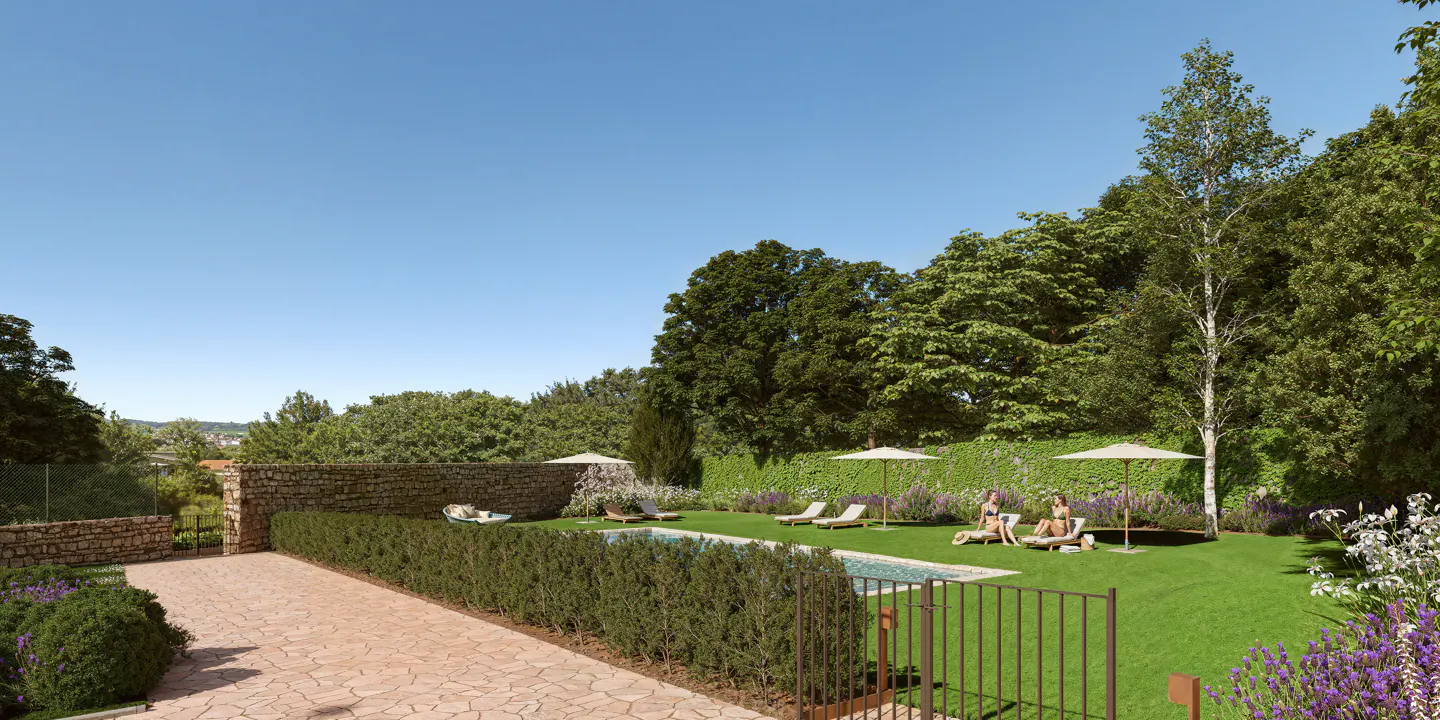 Outdoor pool area with lounge chairs, umbrellas, and lush green landscaping. Two women are sunbathing. Blue sky.