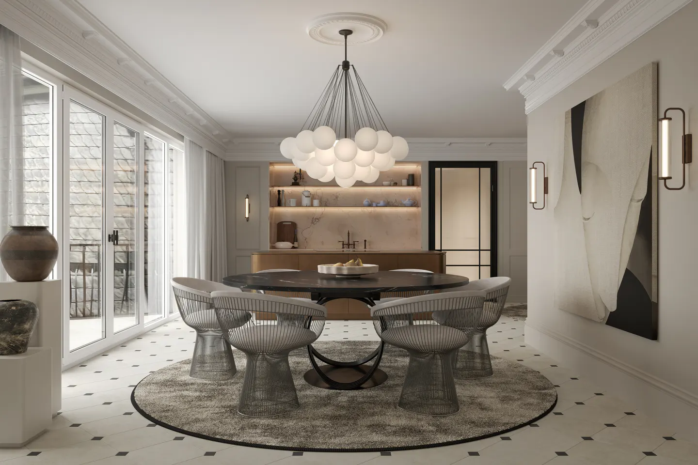 A dining room with a round table, six chairs, and a bubble chandelier. A painting hangs on the wall.
