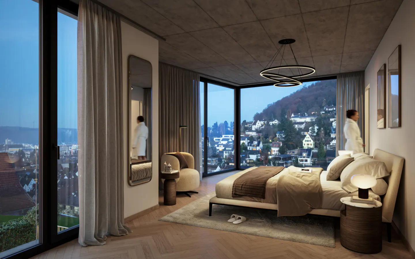 Bedroom with a large window view of a hillside town. A woman in a white robe stands by the bed. Modern lighting and decor.