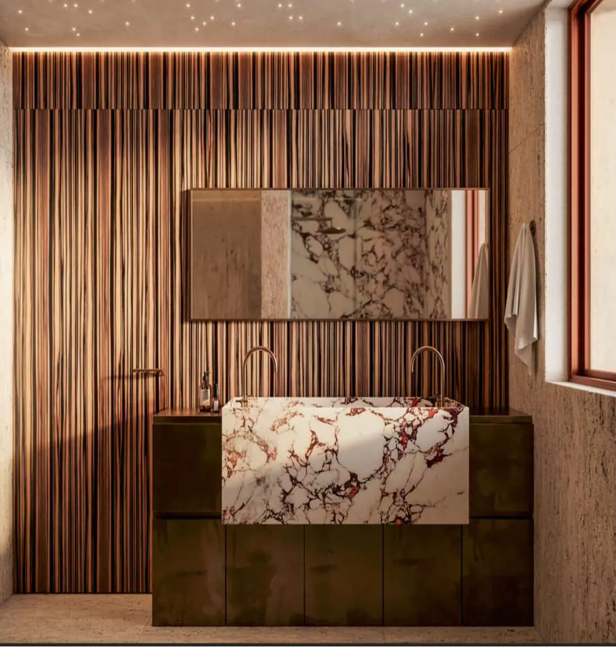 A modern bathroom with a marble countertop, copper fixtures, and a wood-paneled wall. A towel hangs near a window.