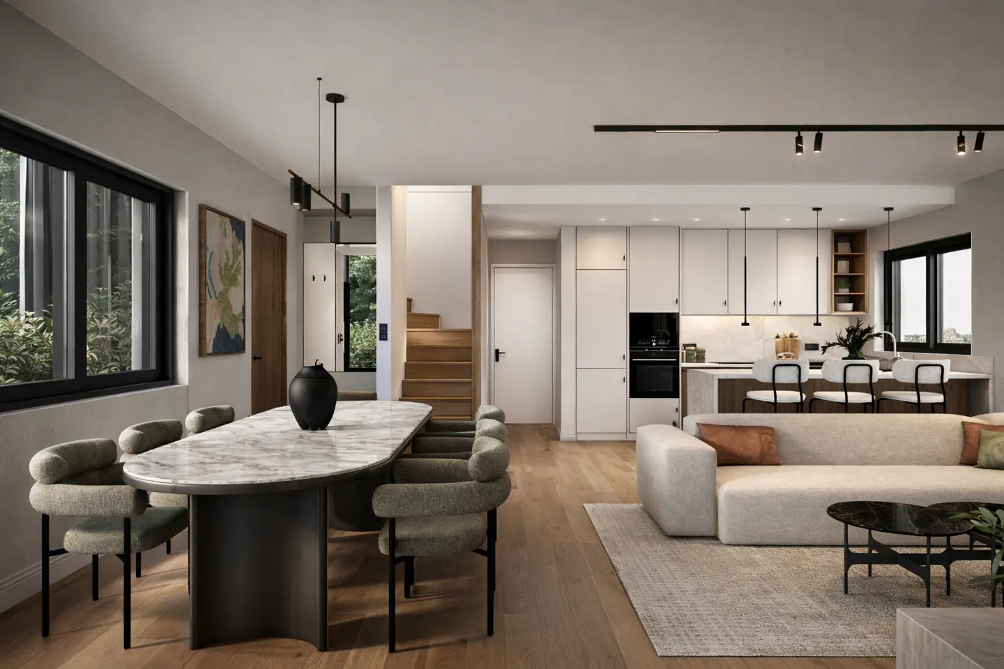 Open-concept living space with a dining table, kitchen island with stools, and a beige sofa on a light wood floor.