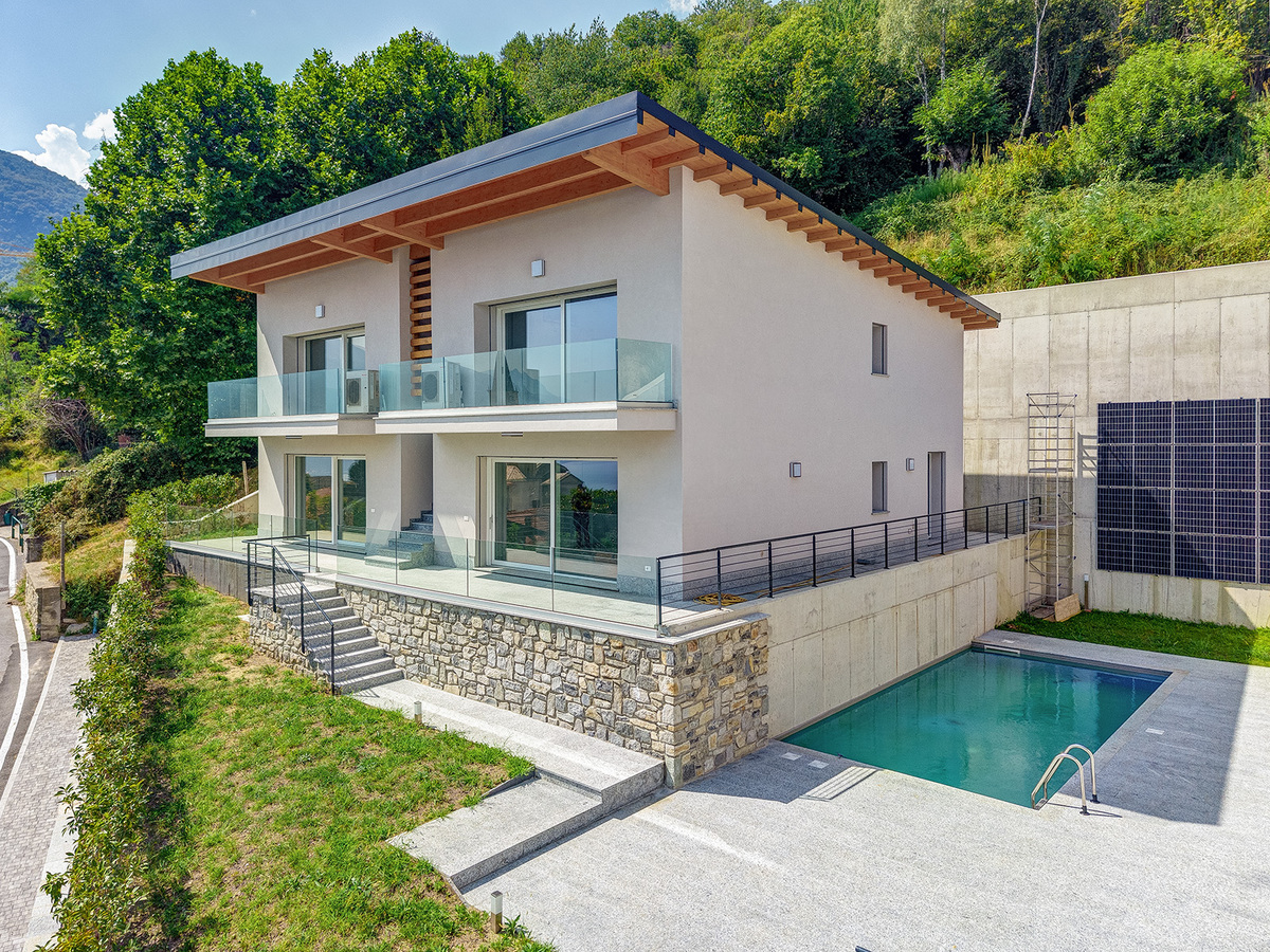 Modernes Erdgeschoss-Apartment mit freiem Seeblick und Pool in einer Neubau-Wohnanlage