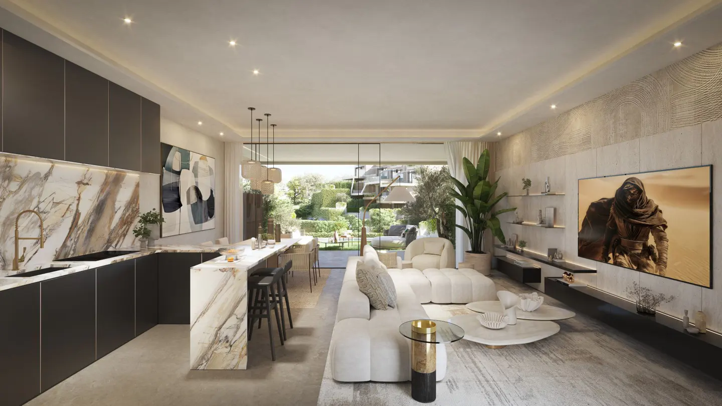Open-concept living space with a kitchen island, white sofa, and large TV. Outside, a lush green garden is visible.
