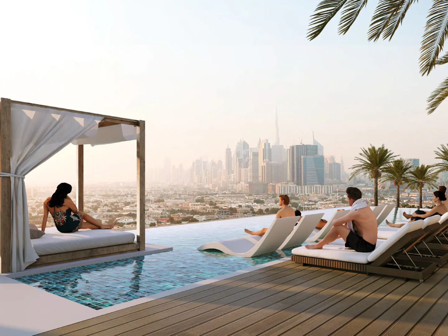 Rooftop pool with city view. People lounge on chairs and a daybed. Palm trees and Dubai skyline in the background.