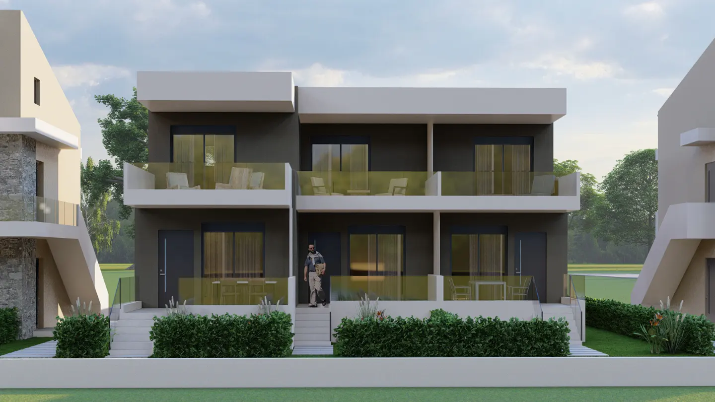 Modern two-story townhouse with gray walls, white trim, and glass balconies. A man and child stand on the steps.