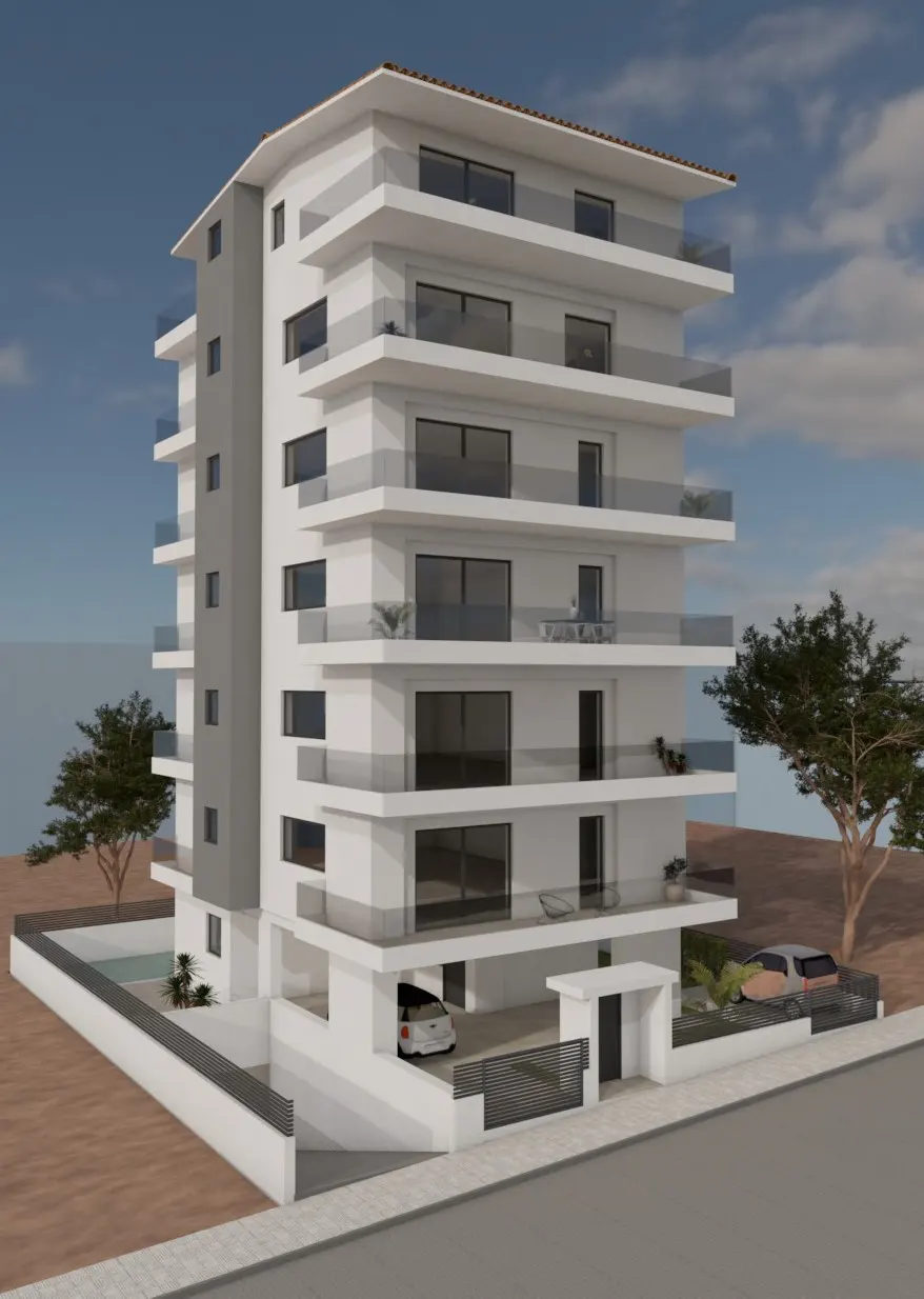 A six-story white apartment building with glass balconies, a gray side, and cars parked underneath.