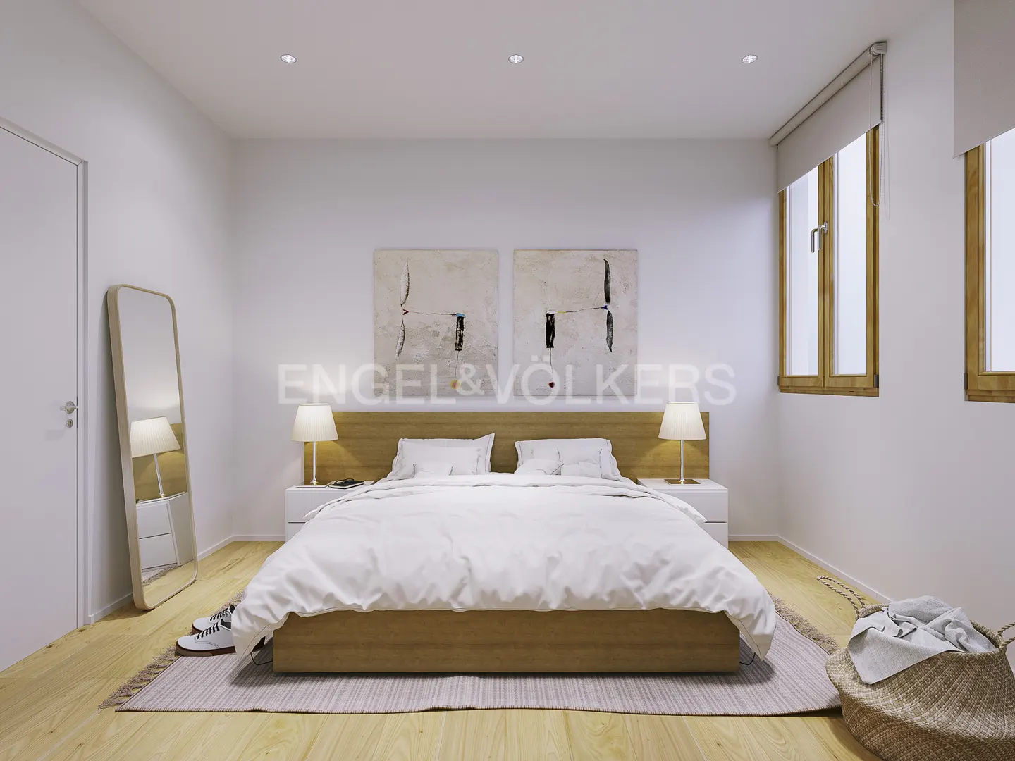 Bright bedroom with a wood-frame bed, white linens, and matching nightstands. Two abstract paintings hang above the headboard.