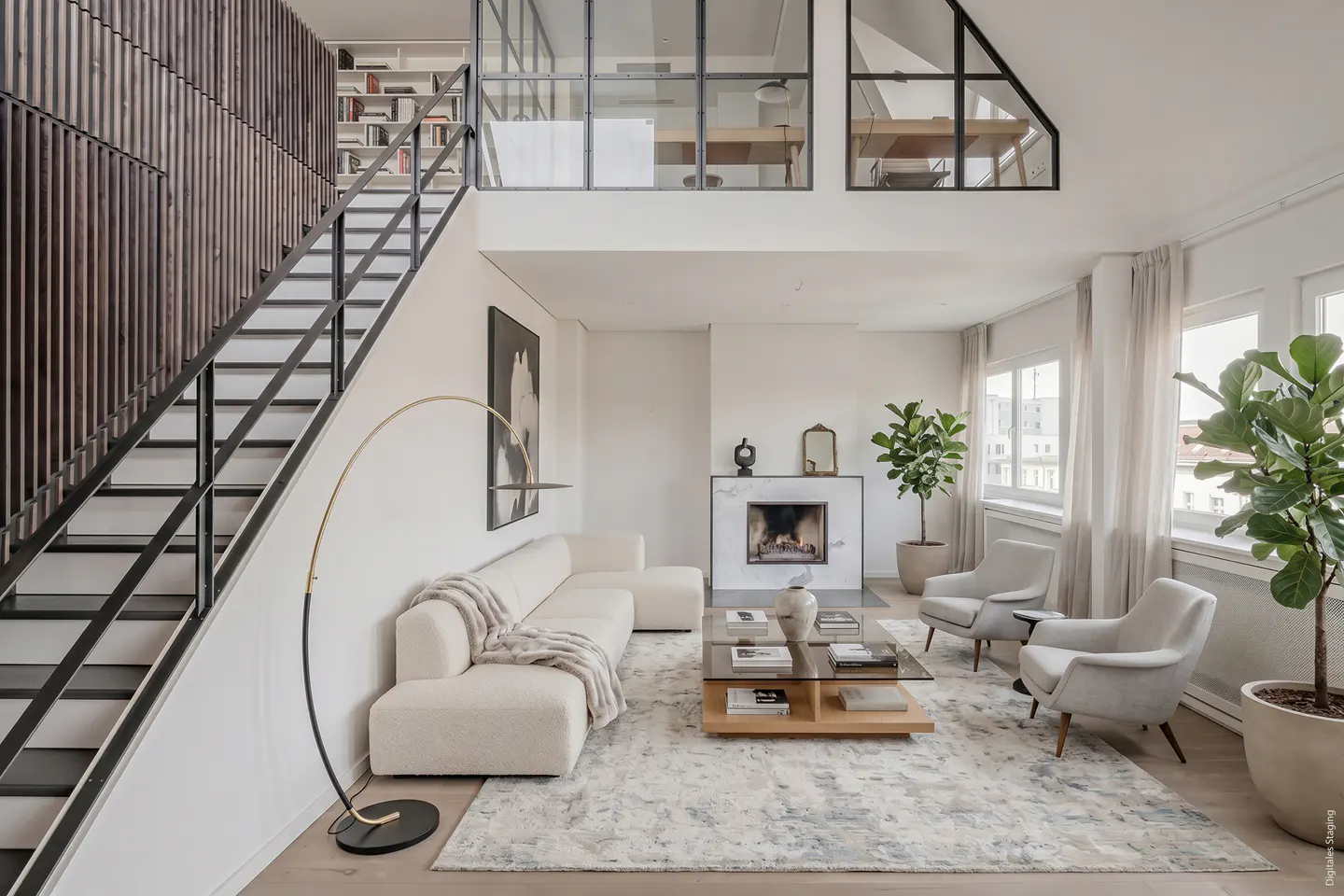 Bright, modern living room with white sofa, chairs, and fireplace. Black metal staircase leads to a loft area with glass windows.