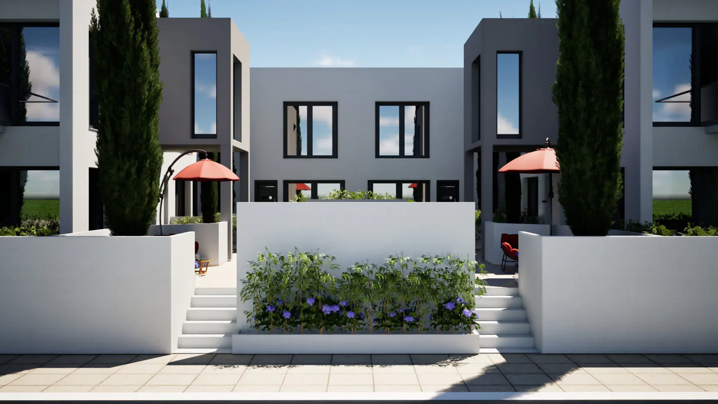 Modern townhouses with white walls, black framed windows, and red umbrellas. Stairs lead to patios with greenery.