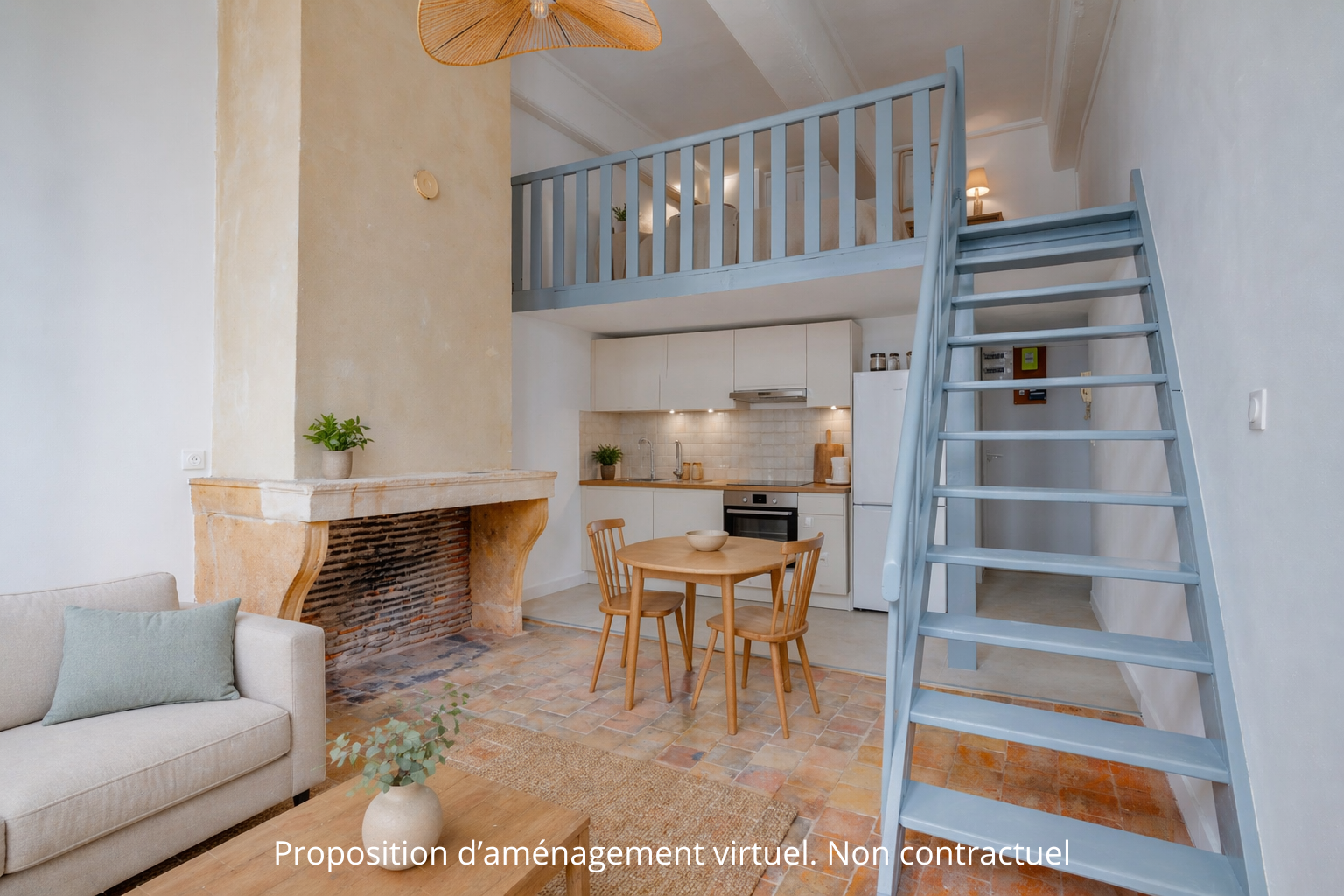 Cozy apartment interior with a stone fireplace, a small kitchen, and a blue staircase leading to a loft area.
