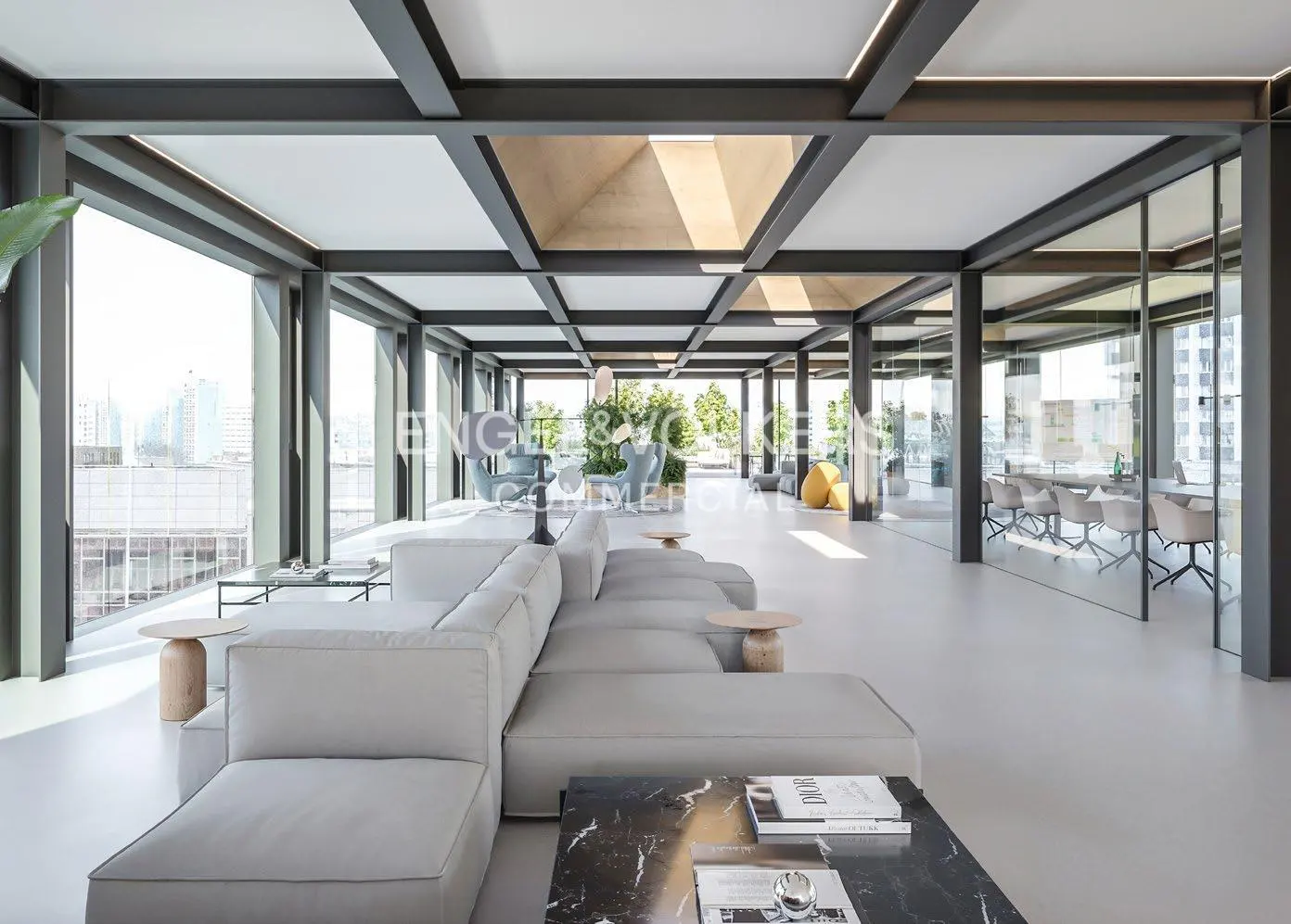 Bright, modern office space with a gray sectional sofa, black marble table, and glass-walled conference room. Large windows offer city views.