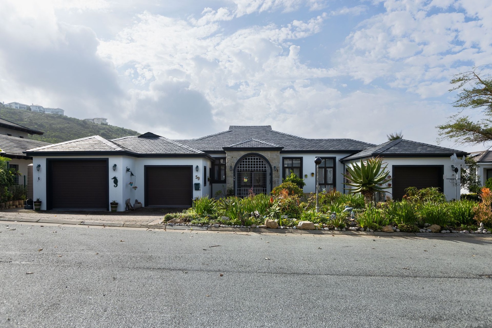 Elevated Golf Estate Living with Ocean, Mountain and Fairway Views