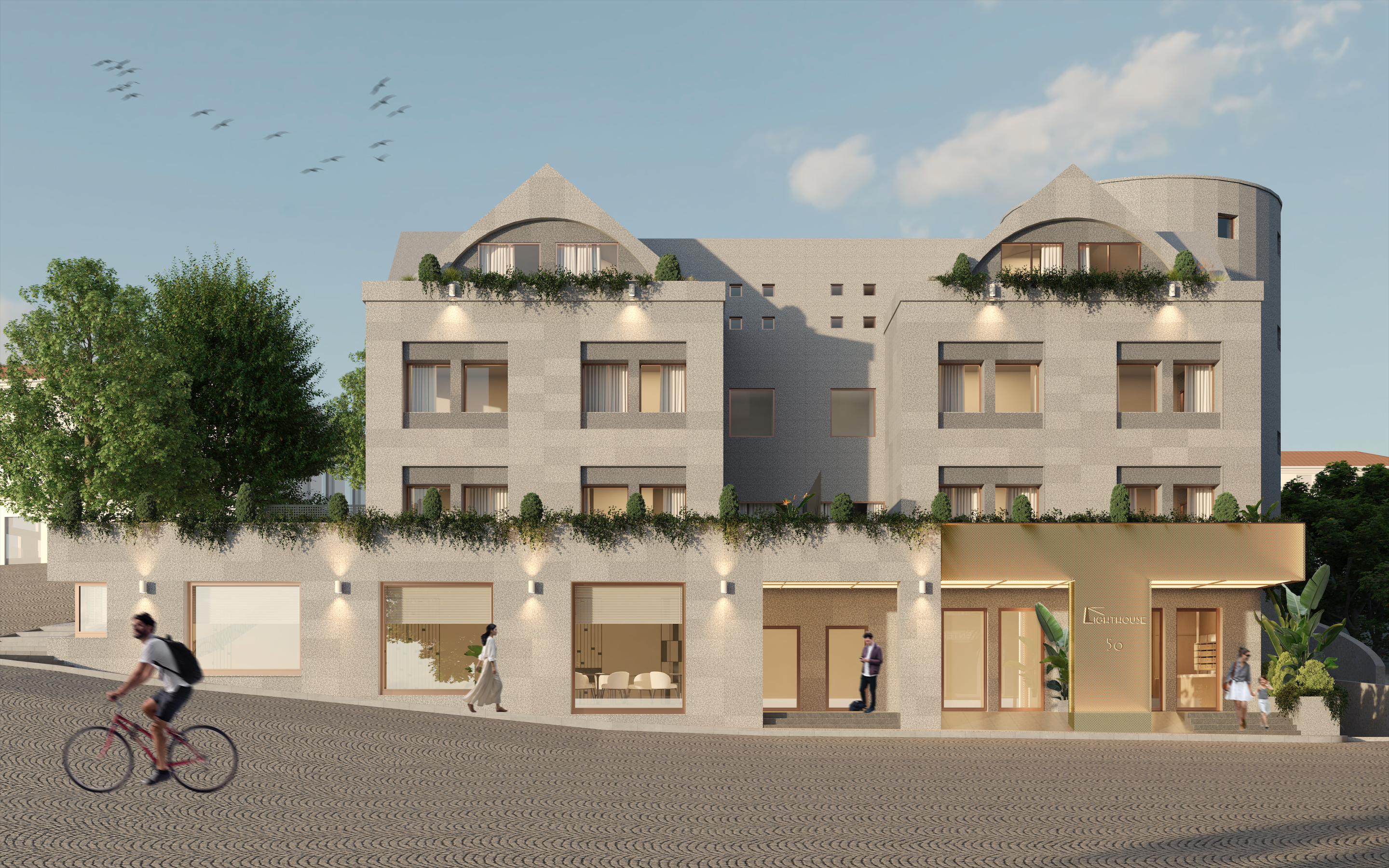 A modern stone apartment building with ground-floor retail, a cyclist in the foreground, and people walking on a paved street. [AI-generated text]
