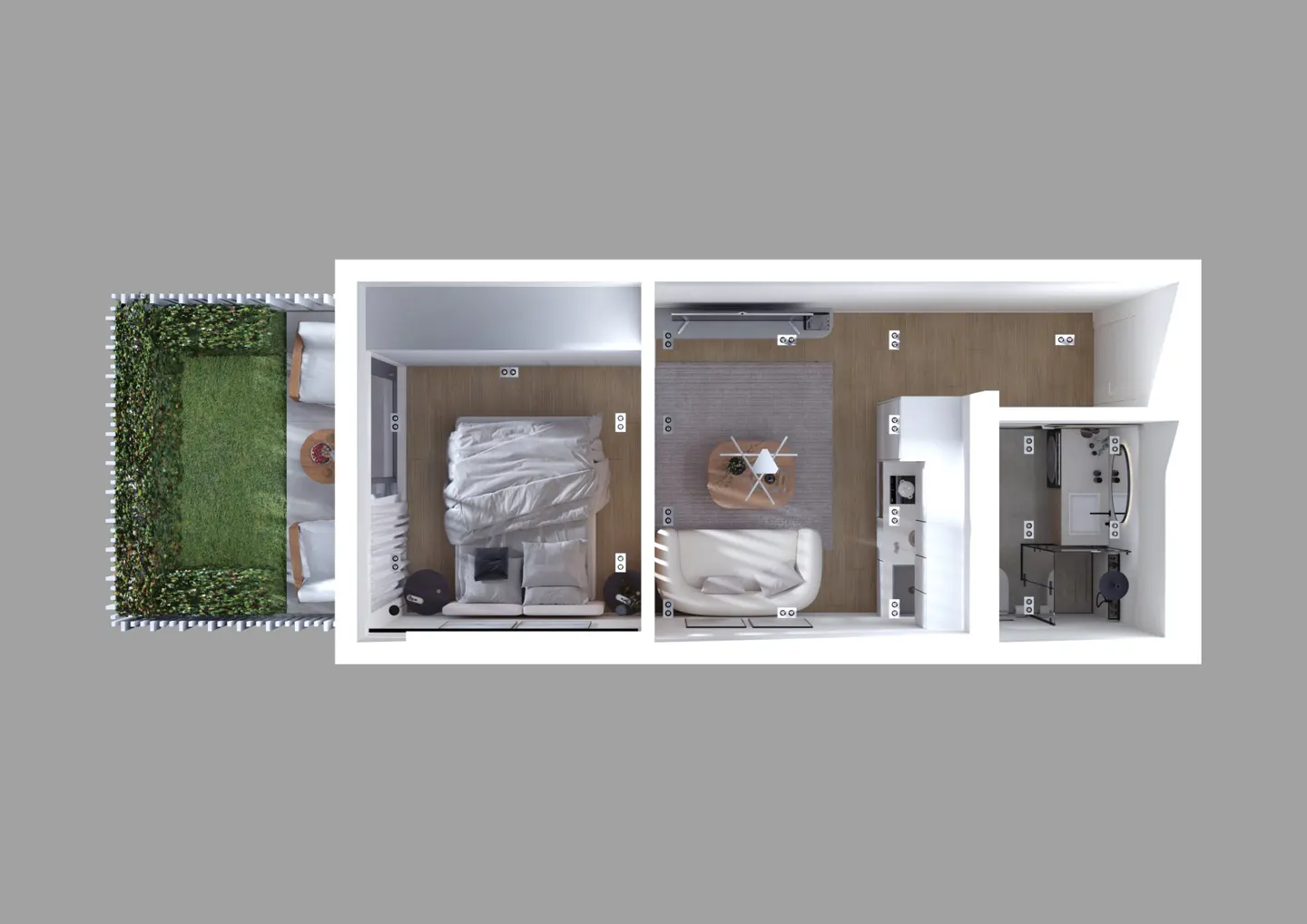 Aerial view of a studio apartment with a bed, couch, kitchen, bathroom, and a green patio.
