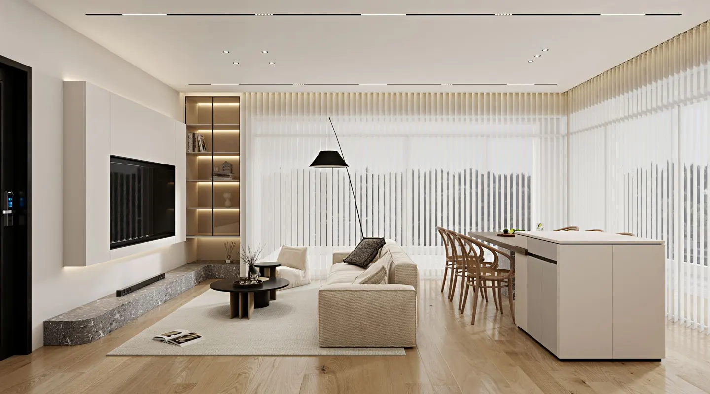 A modern living room with a beige sofa, black floor lamp, and a kitchen island with wooden chairs.