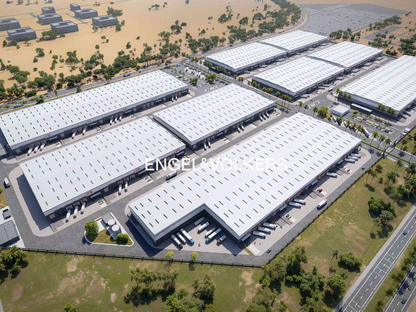 Aerial view of a large industrial park with multiple white-roofed warehouses, loading docks, and parking lots.