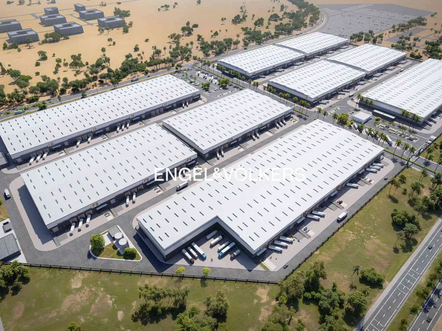 Aerial view of a large industrial park with multiple white-roofed warehouses, loading docks, and parking lots.