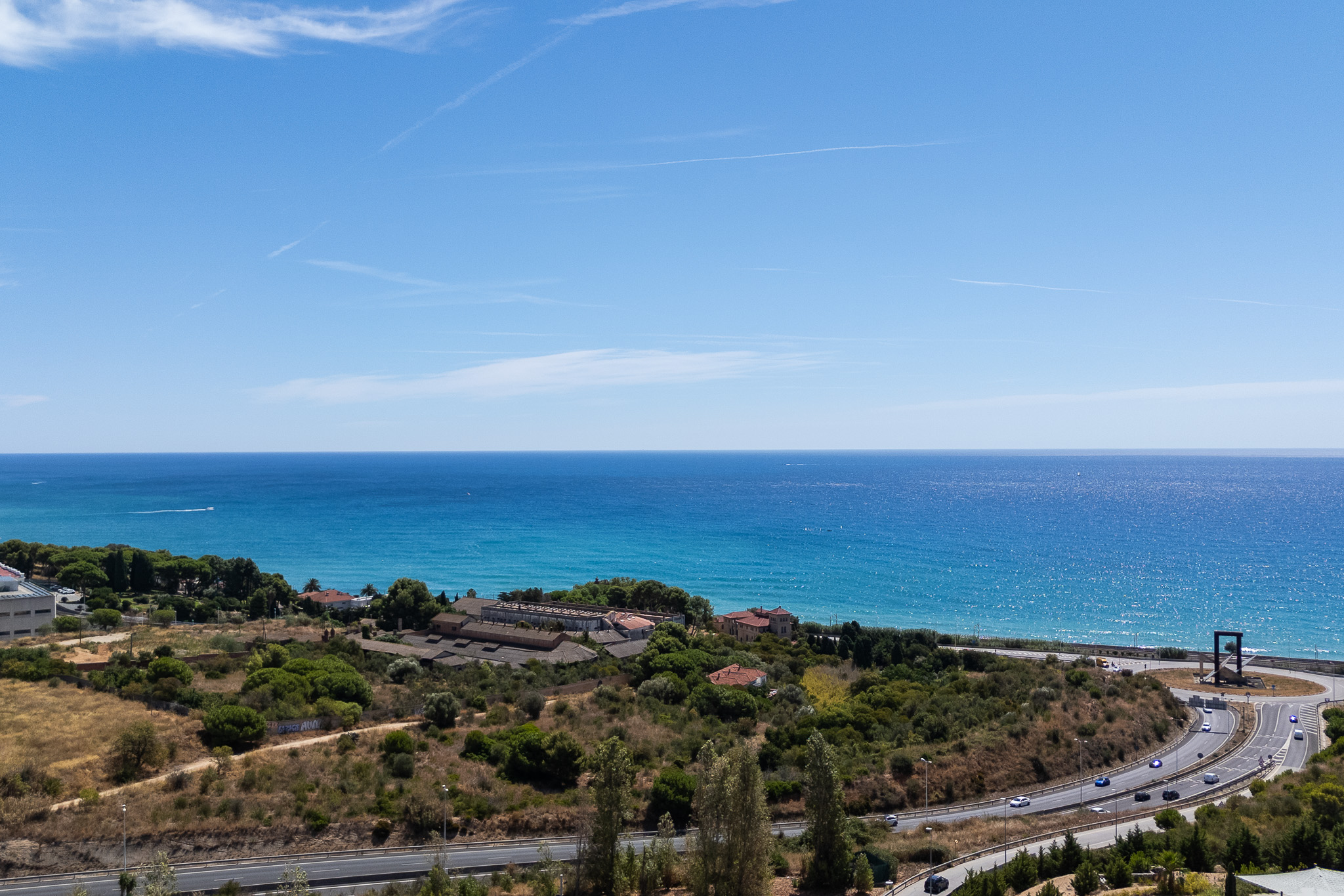Exclusive contemporary villa in Montgat with a pool, jacuzzi, elevator, three-car garage, and panoramic views of the sea, mountains, and Barcelona.